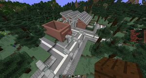 A Minecraft screenshot of New Clygro Town in April 2021, with only a single complete building with the Live Forever house under construction.