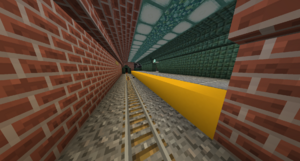 A underground ClyRail platform with dark prismarine one the side with the platform and bricks on the railway side. There is gravel located where the rails are. The platforms are 3 blocks wide with a yellow line, which represents the line colour. There are ClyRail maps on each end of the platform. There is an exit in the middle of the platform.